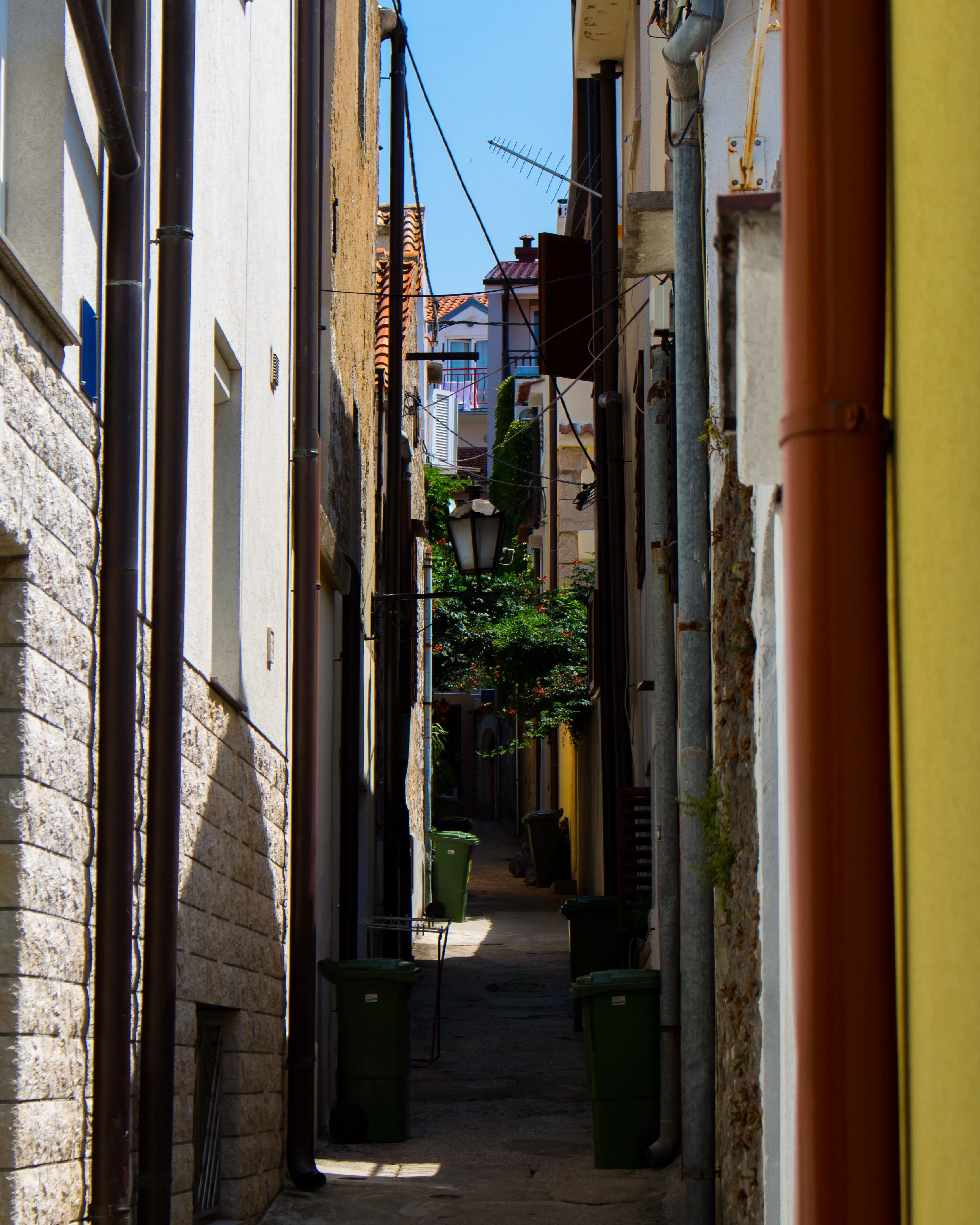 A small road with beautiful, colorful buildings on each side